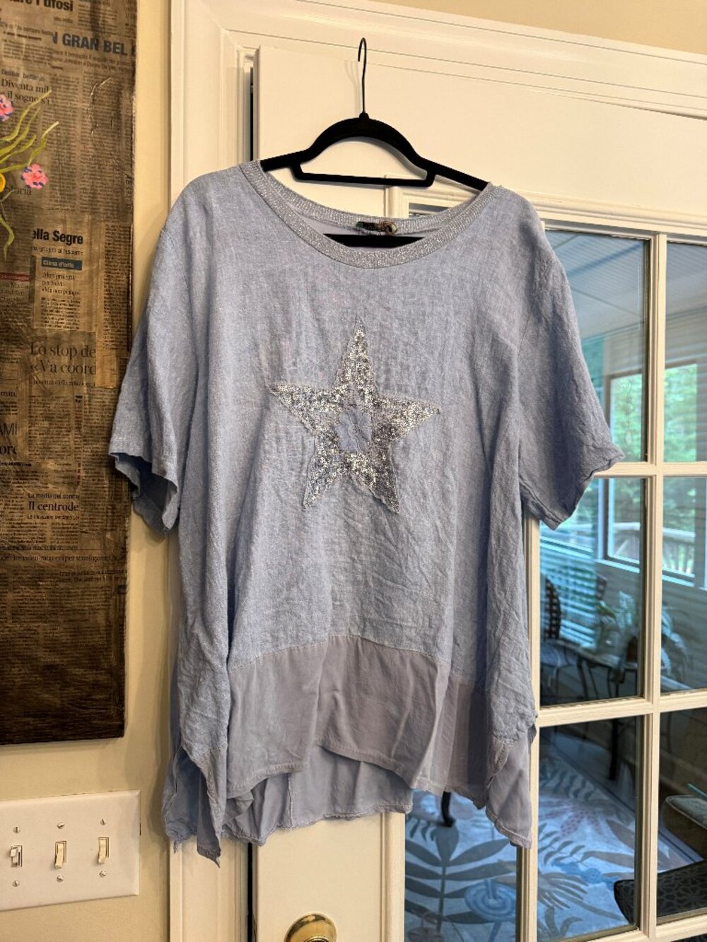 Short sleeve blue star design shirt.